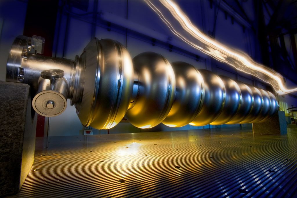 Each cryomodule houses a string of acceleration cavities like this one. Cavities propel the particles as the particles move through them. At LCLS-II, electrons will charge through one cavity after another, picking up energy as they go. Pictured here is a 1.3-gigahertz cavity. Photo: Reidar Hahn